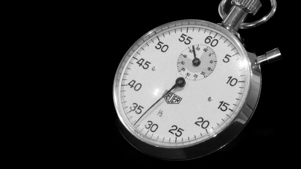 Core Web Vitals speed concept: close-up of a stopwatch on black