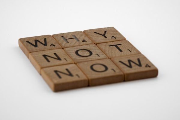 a close up of a wooden block with words on it