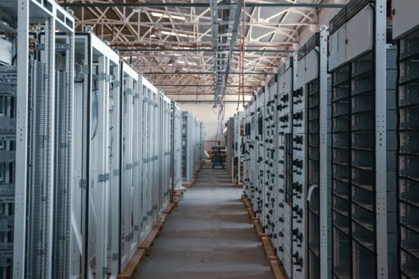 Server room aisle with metal equipment racks