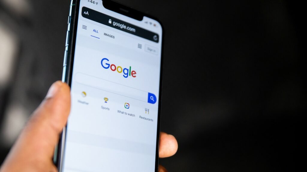 Local SEO in Hull: a hand holding a smartphone showing Google search