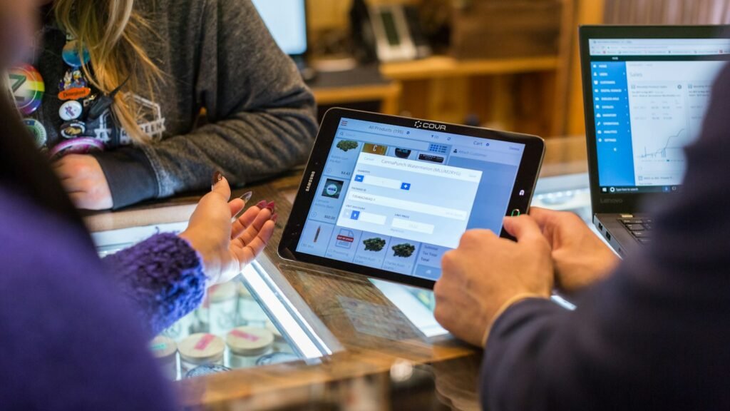 Client portals in use: two people at a table looking at a tablet