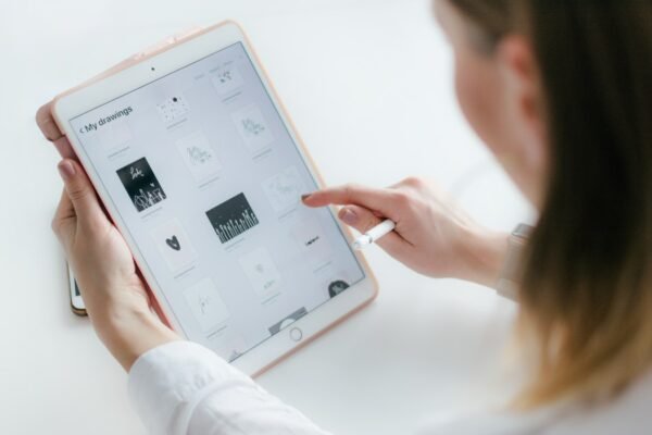 Woman using gold iPad