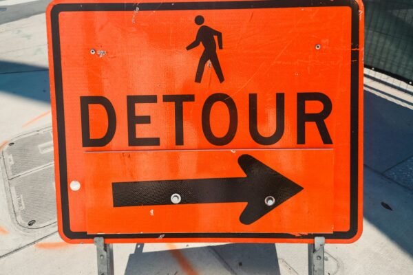 A detour sign on the side of the road