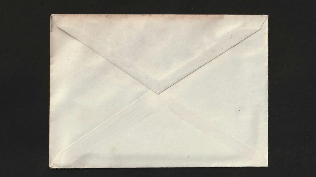 A white envelope on a black background