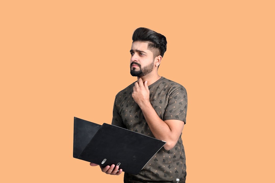 Why Your Website Is Quietly Costing You Customers — And How To Fix It In 2026 2 A Man Holding A Laptop