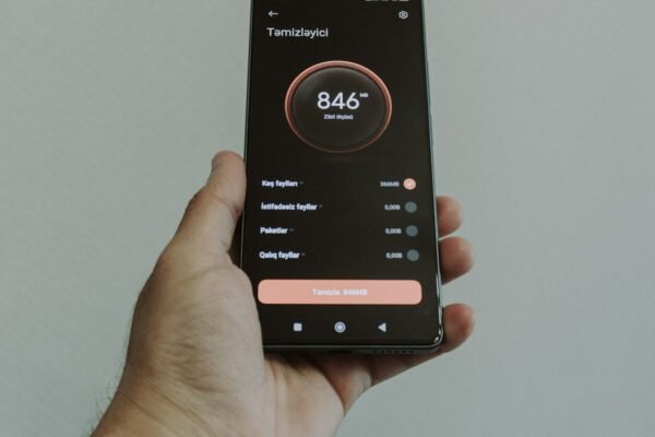 Hand holding smartphone displaying a health application