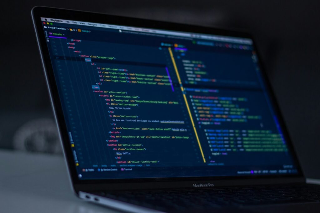 A code editor open on a laptop screen
