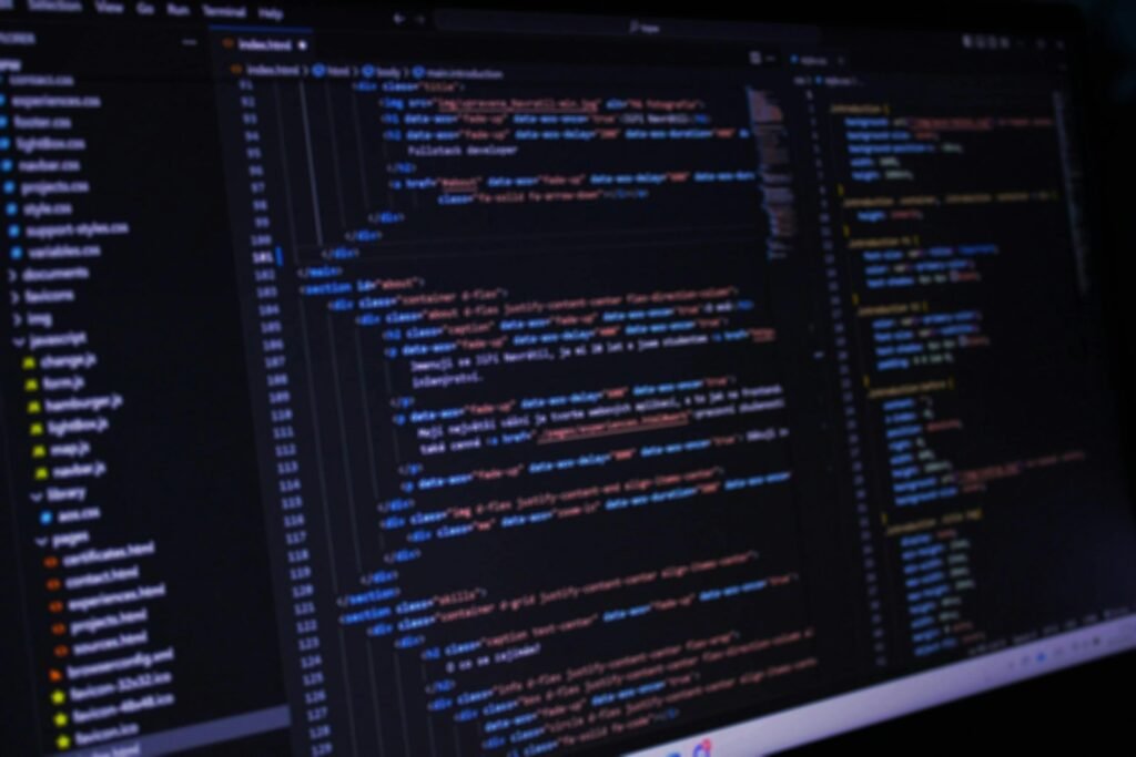 A computer screen showing lines of code in a dark editor, slightly out of focus