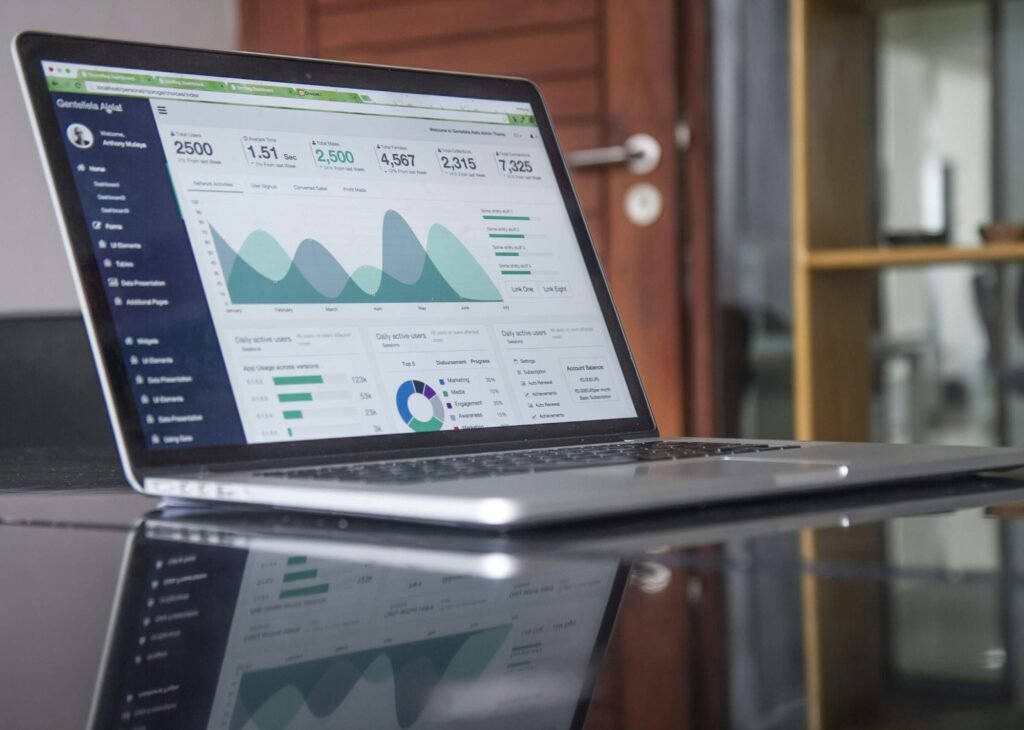 A laptop showing live business performance charts