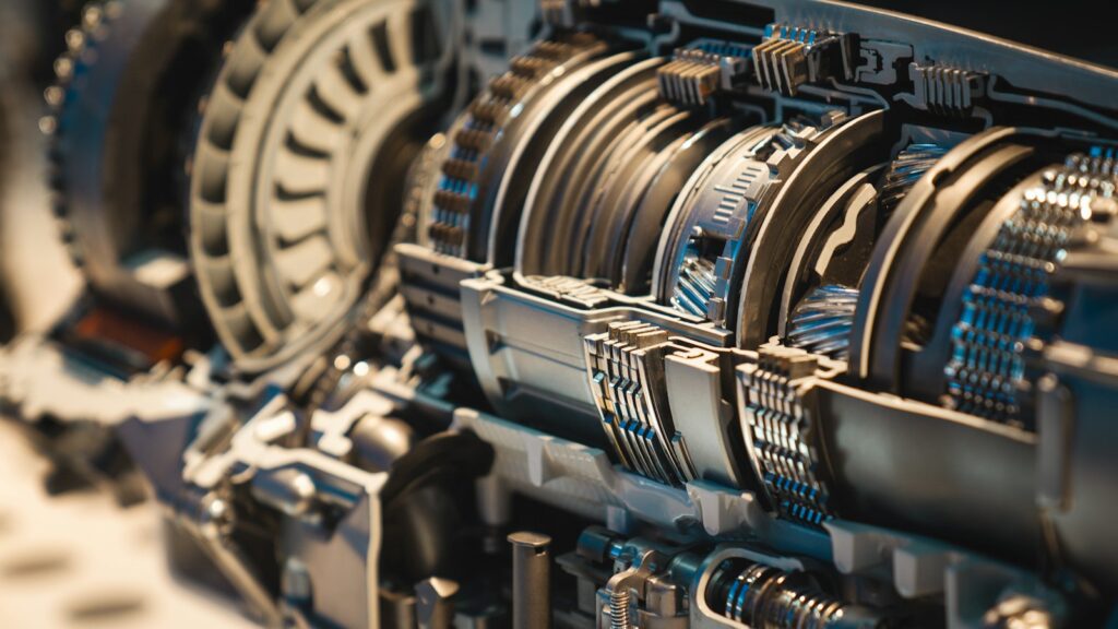 Cutaway view of the gears inside a gearbox, like the moving parts of custom automation